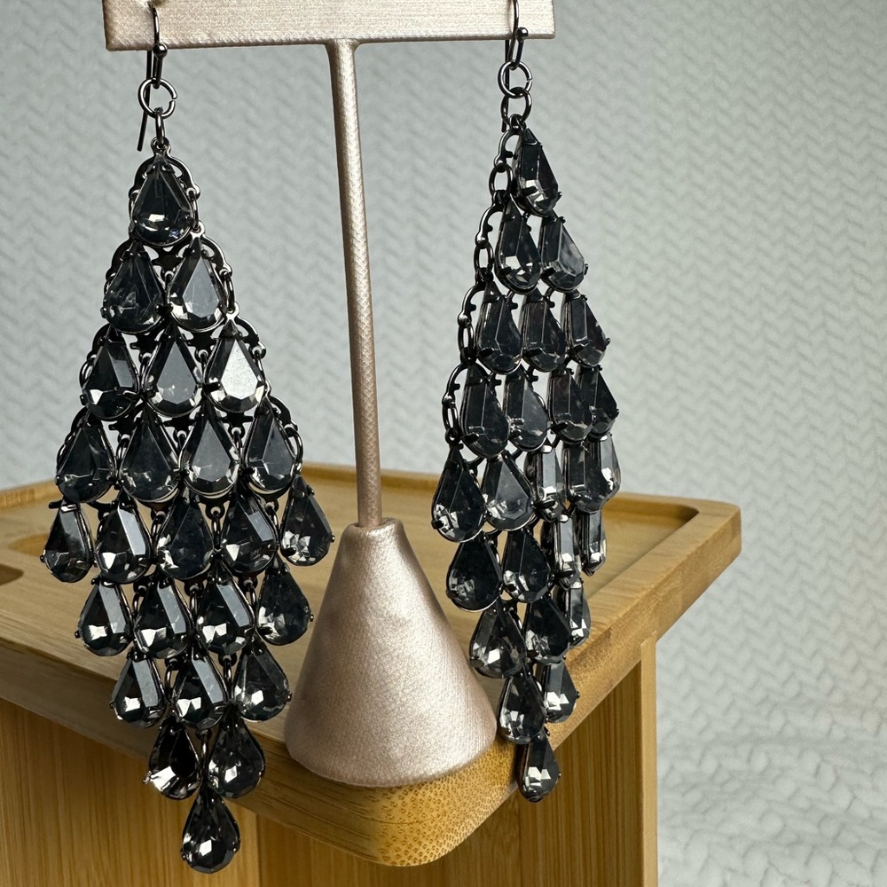 Dangle earrings with black baubles.